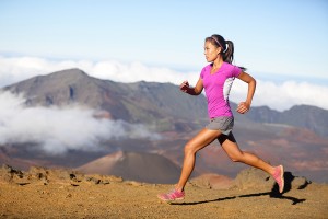 Female running athlete. Woman trail runner sprinting for success