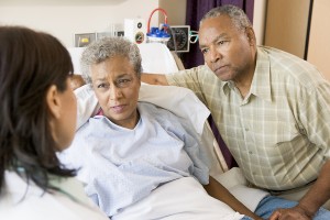 Doctor Talking To Senior Couple