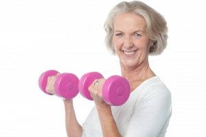 OLDER WOMAN LIFTING WEIGHTS
